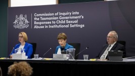 Three commissioners at a high table: Professor Leah Bromfield, Marcia Neave AO and Robert Benjamin AM.