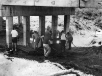 Police at the murder scene under Sensible Creek bridge in 1972, where only one of the girls was found.